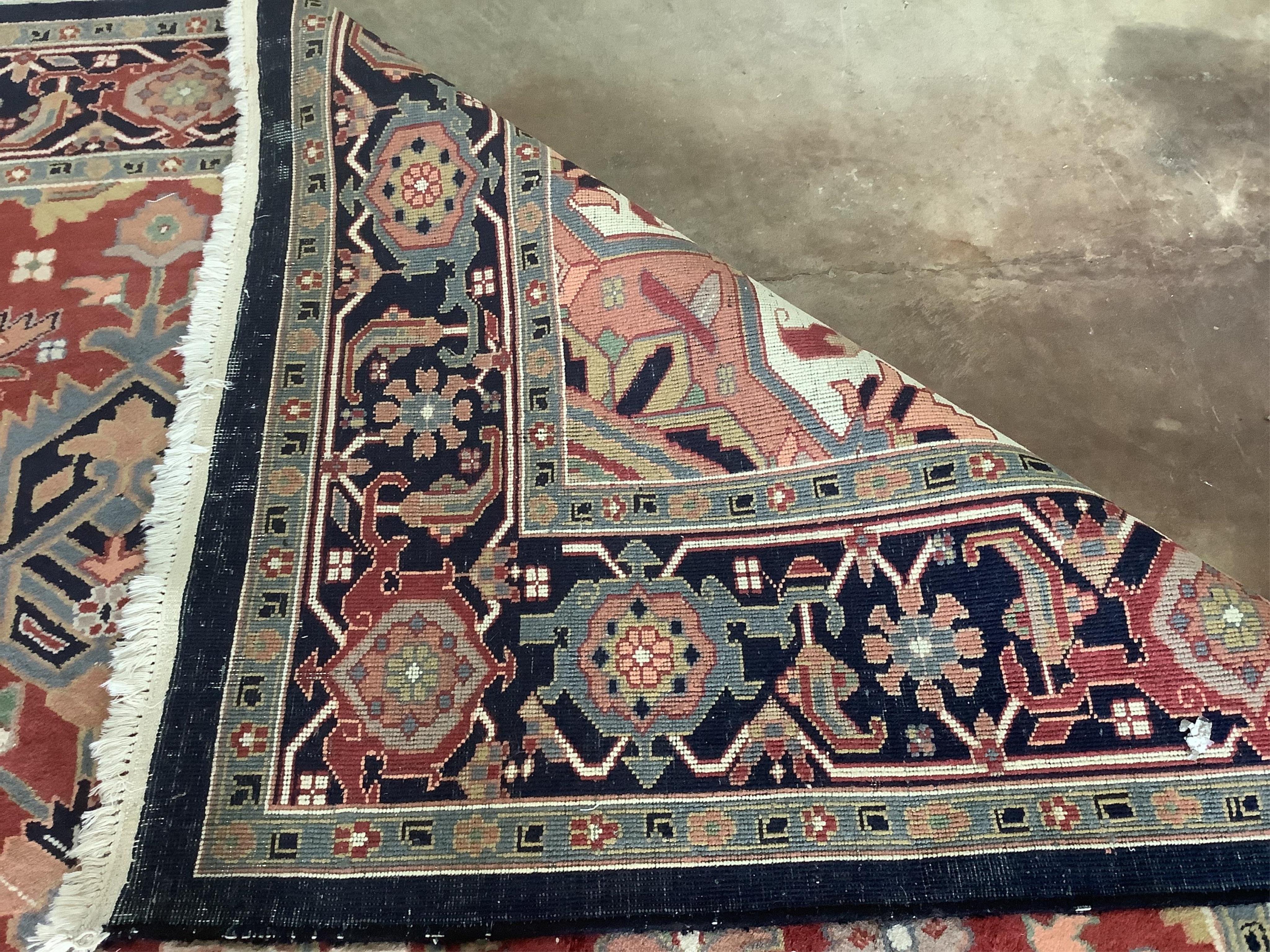 An Indo Persian Heriz carpet, 430 x 300cm. Condition - good